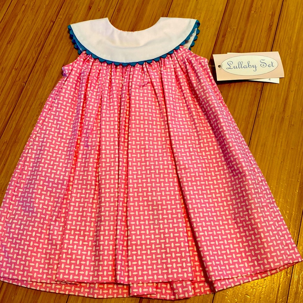 Lullaby set dress. Brand new. Boutique dress. Never worn. 12 months